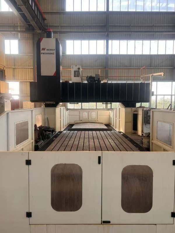 纽威PM3060HZ。工作台3X6米，门宽3.8米，门高1.6米。.